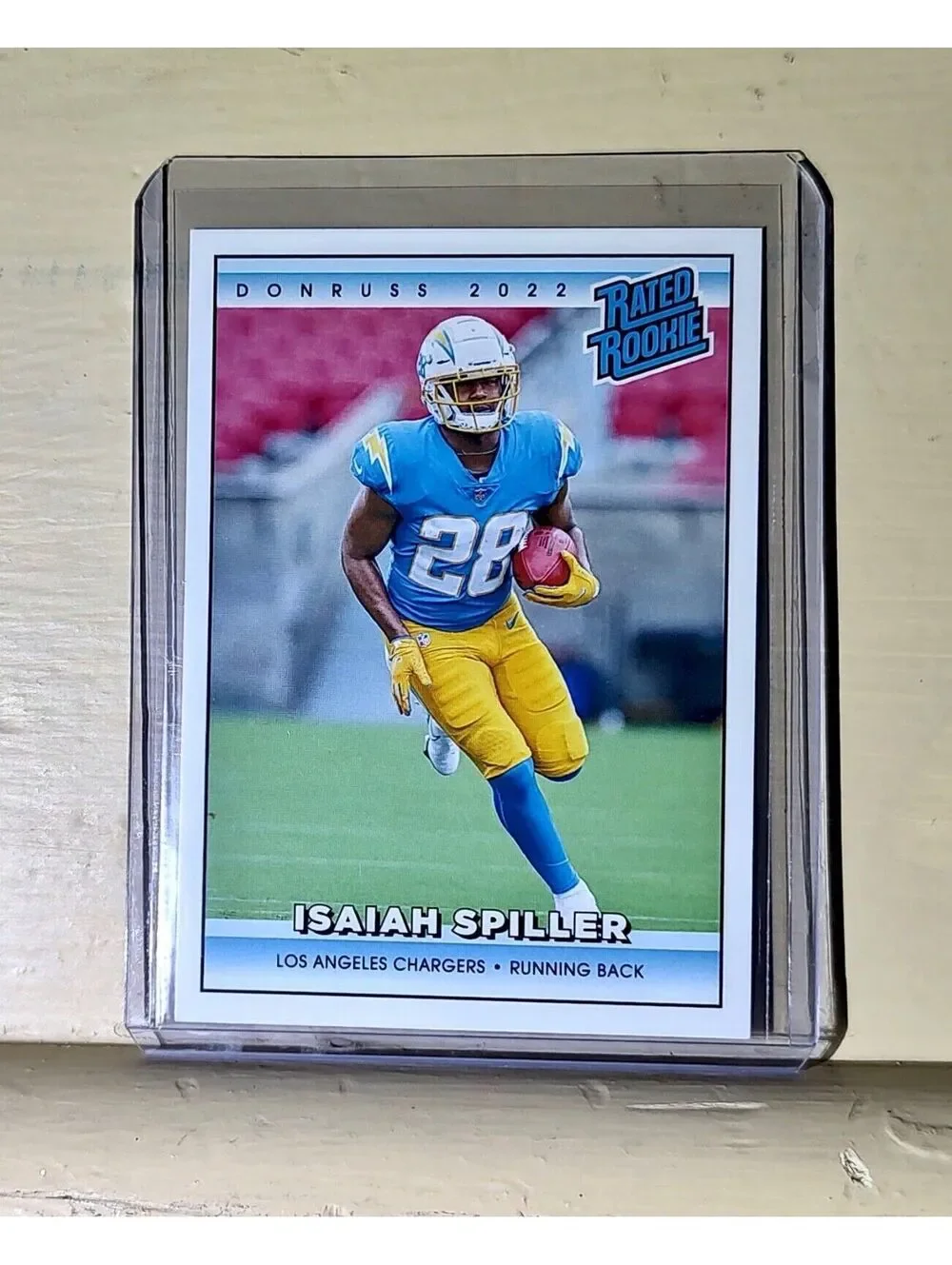 Isaiah Spiller 2022 NFL Panini #34 Rated Rookie Retro Football Card 1/4094